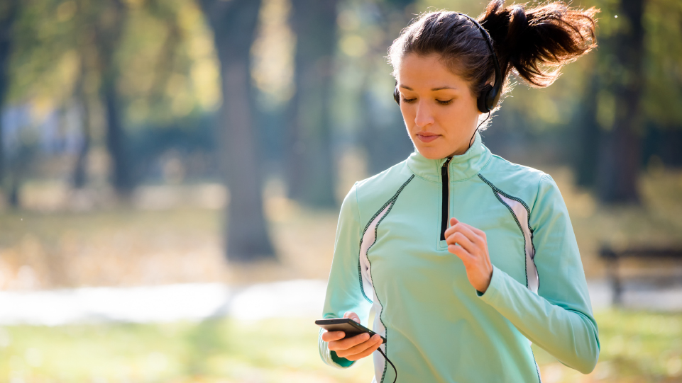 Woman jogging while listening to music