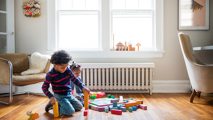 Two children playing with blocks