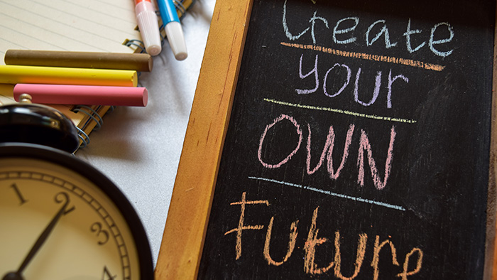 A chalkboard that says "Create your own future"