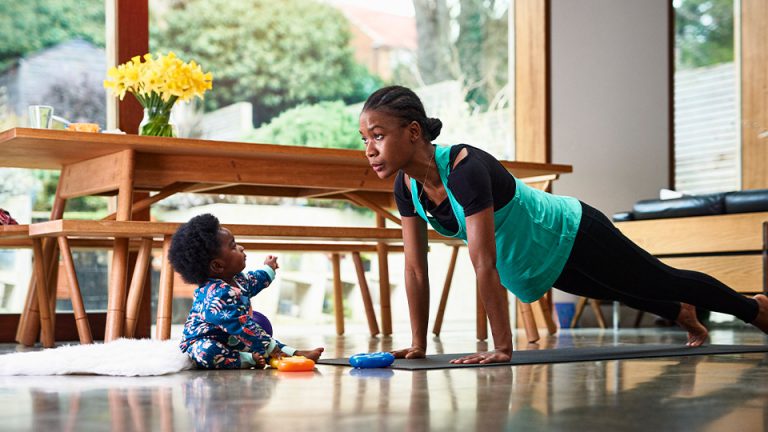 woman in plank with toddler: work/life balance