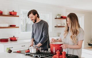 couple in kitchen cooking