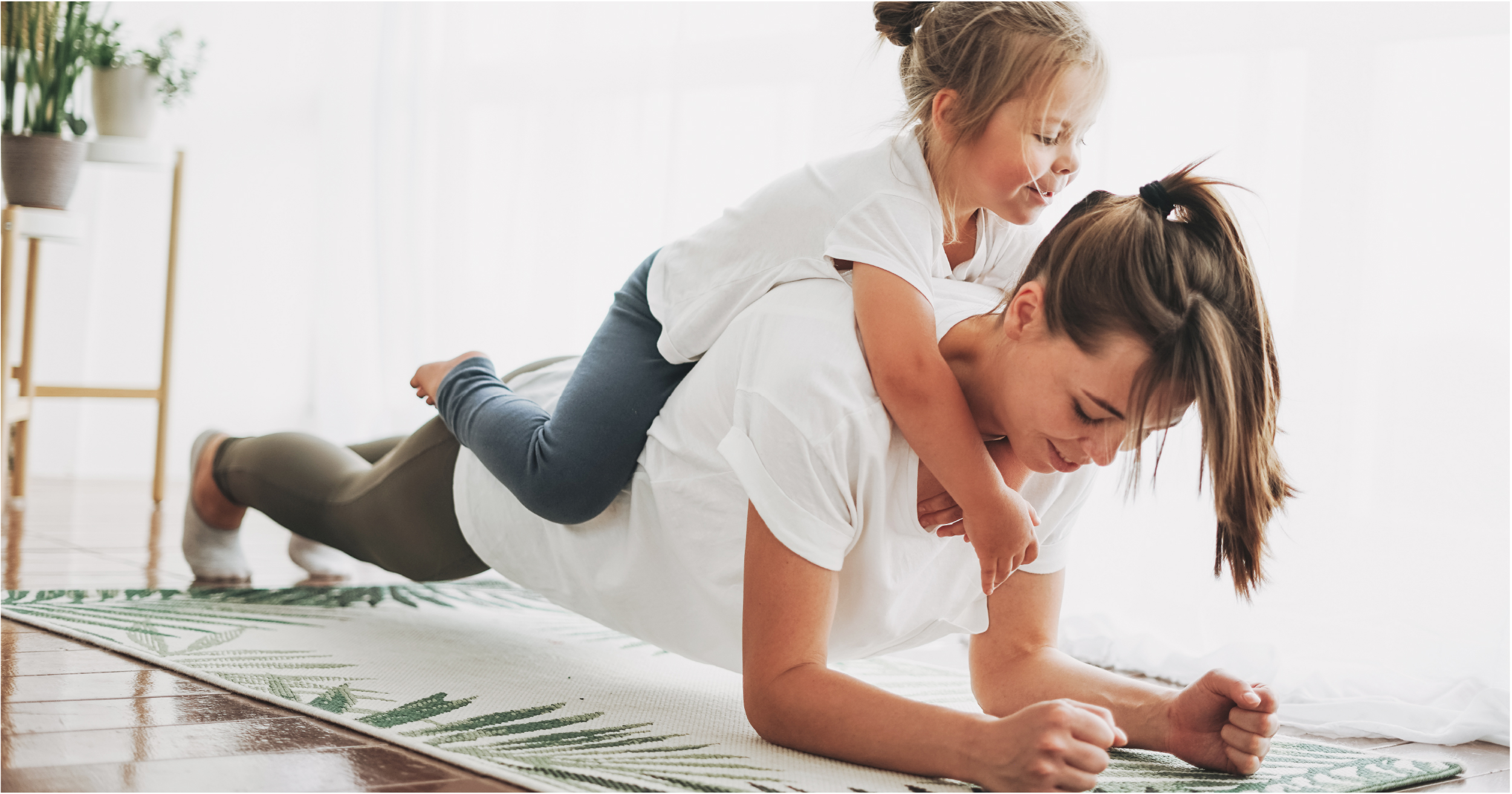 woman planking with kid