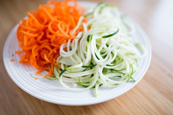 Zoodles and canoodles on a white plate