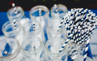 paper straws and water glasses