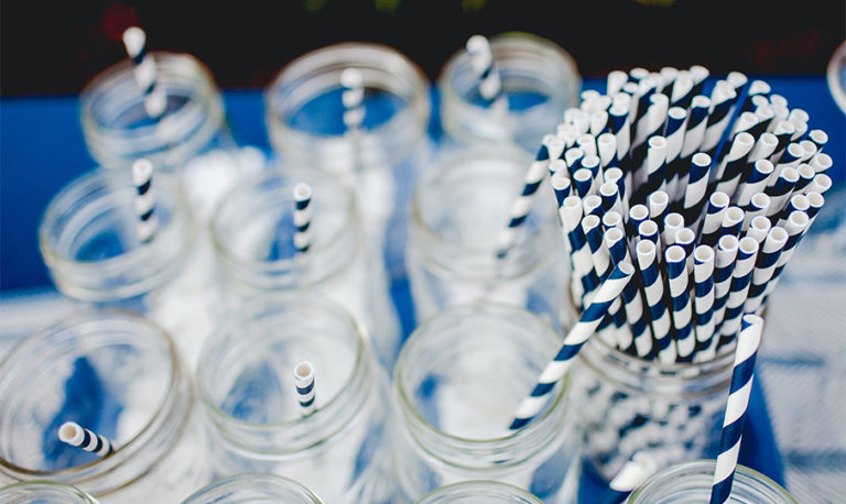 paper straws and water glasses