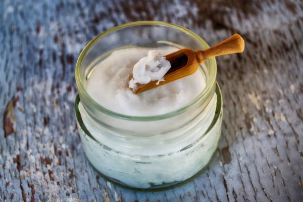 Solid coconut oil in a glass jar