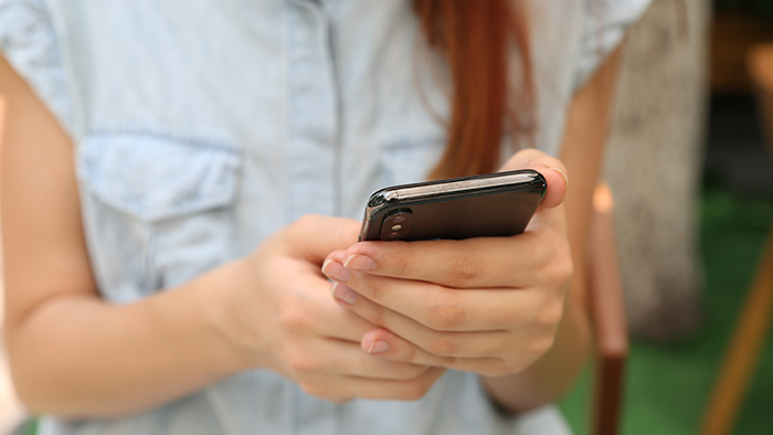 Hands holding a cellphone