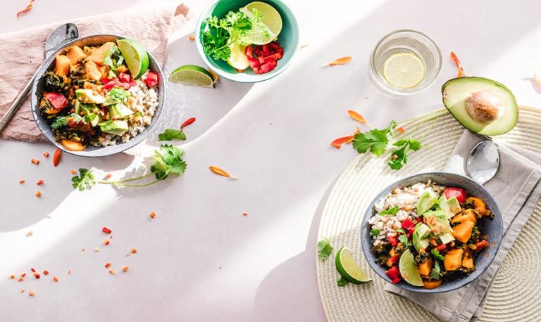 Two healthy protein bowls on a white table