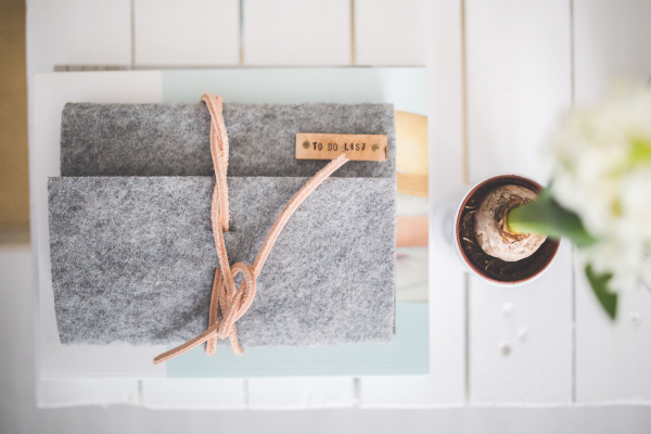 Gray to-do list notebook on white table