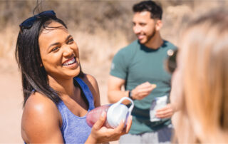 Woman smiling and socializing on a hike